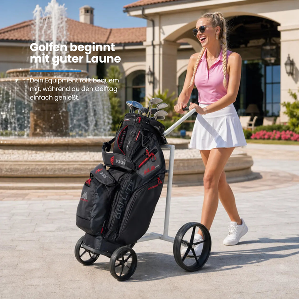 Big Max e-Lite 4 Rad Elektro Trolley mit Golfausrüstung, eine Frau zieht den Trolley auf einem Platz.