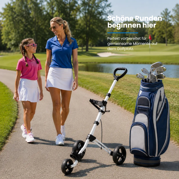 Big Max Junior Max 3W Push Trolley mit Golftaschen und -schlägern auf einem Golfplatz.